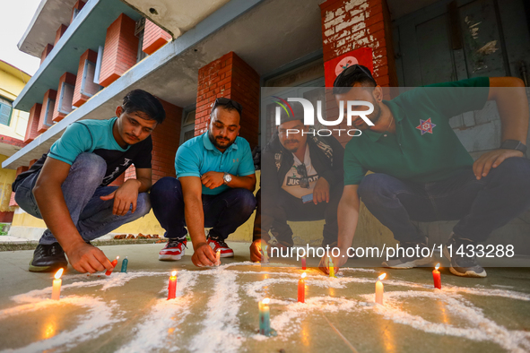 Nepali students affiliated with the Nepal Student Union, the student wing of the Nepali Congress, are holding a candlelight vigil in memory...