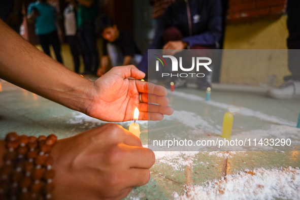 Nepali students affiliated with the Nepal Student Union, the student wing of the Nepali Congress, are holding a candlelight vigil in memory...