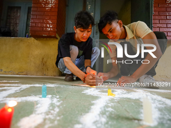 Nepali students affiliated with the Nepal Student Union, the student wing of the Nepali Congress, are holding a candlelight vigil in memory...