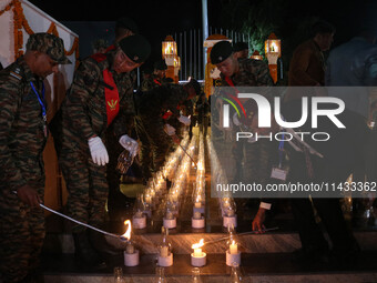 Indian Army soldiers are lighting candles at a war memorial during the ''Vijay Diwas'' or Victory Day celebration in Drass, about 160 km (99...