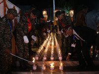 Indian Army soldiers are lighting candles at a war memorial during the ''Vijay Diwas'' or Victory Day celebration in Drass, about 160 km (99...