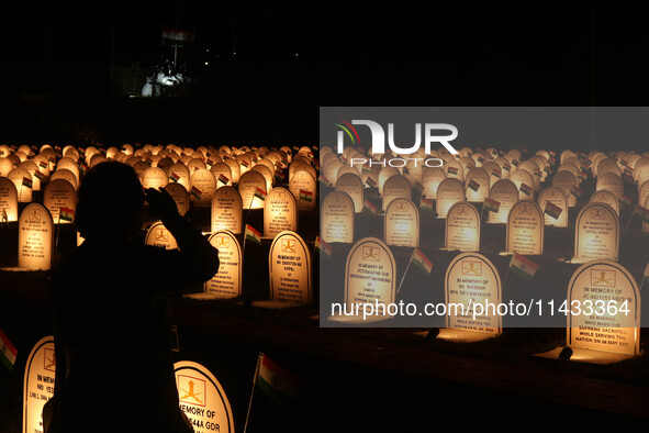 A woman is paying tribute at the war memorial during the ''Vijay Diwas'' or Victory Day celebration in Drass, about 160 km (99 miles) east o...