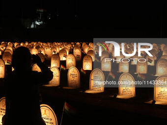 A woman is paying tribute at the war memorial during the ''Vijay Diwas'' or Victory Day celebration in Drass, about 160 km (99 miles) east o...