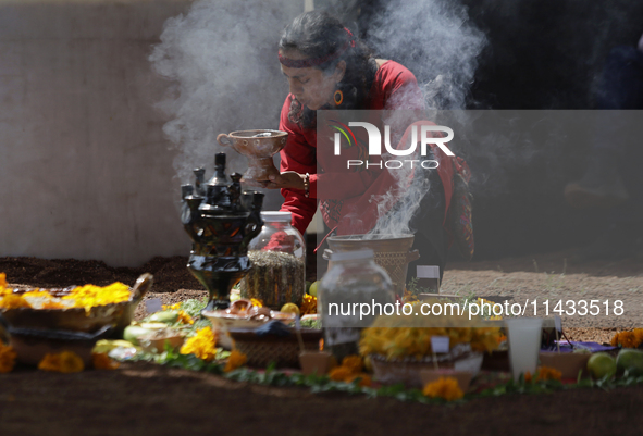 They are performing a pre-Hispanic ceremony to Mother Earth during the presentation of the strategic project for the conservation of the Cem...