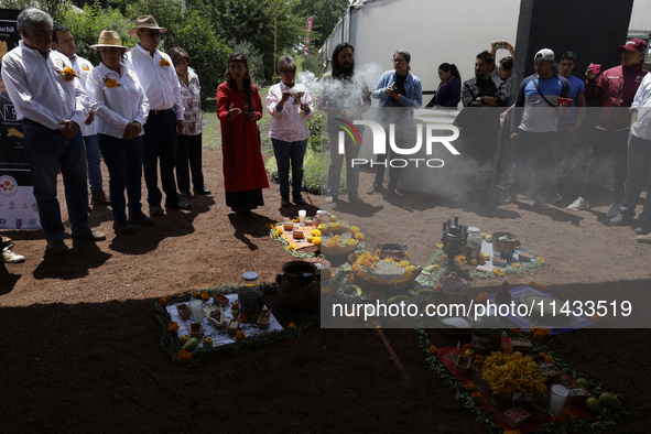 They are performing a pre-Hispanic ceremony to Mother Earth during the presentation of the strategic project for the conservation of the Cem...