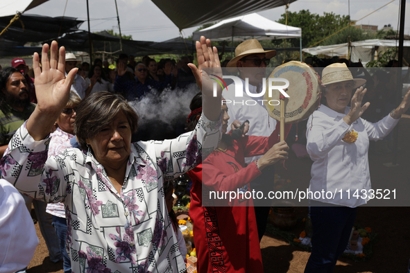 They are performing a pre-Hispanic ceremony to Mother Earth during the presentation of the strategic project for the conservation of the Cem...