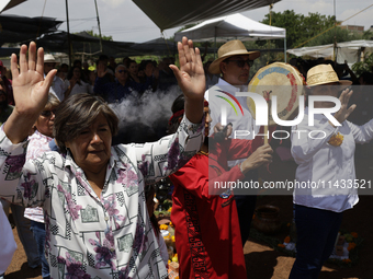 They are performing a pre-Hispanic ceremony to Mother Earth during the presentation of the strategic project for the conservation of the Cem...