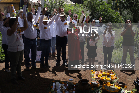 They are performing a pre-Hispanic ceremony to Mother Earth during the presentation of the strategic project for the conservation of the Cem...