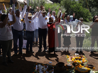 They are performing a pre-Hispanic ceremony to Mother Earth during the presentation of the strategic project for the conservation of the Cem...