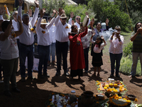 They are performing a pre-Hispanic ceremony to Mother Earth during the presentation of the strategic project for the conservation of the Cem...