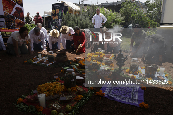 They are performing a pre-Hispanic ceremony to Mother Earth during the presentation of the strategic project for the conservation of the Cem...