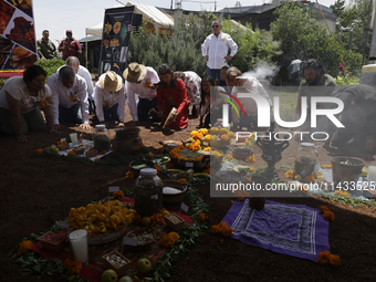 They are performing a pre-Hispanic ceremony to Mother Earth during the presentation of the strategic project for the conservation of the Cem...