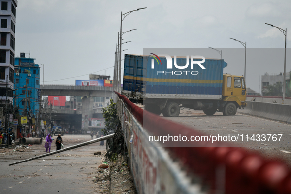 A truck is blocking the road following a clash between anti-quota protesters and the police in Dhaka, Bangladesh, on July 20, 2024. 