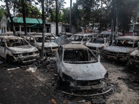 A view of burnt cars inside the Bangladesh Bridge Authority compound is showing the aftermath of students setting them on fire amid the ongo...