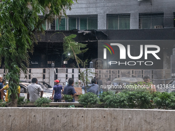 A view of a burnt building is showing after students are setting it on fire amid the ongoing anti-quota protest in Dhaka, Bangladesh, on Jul...