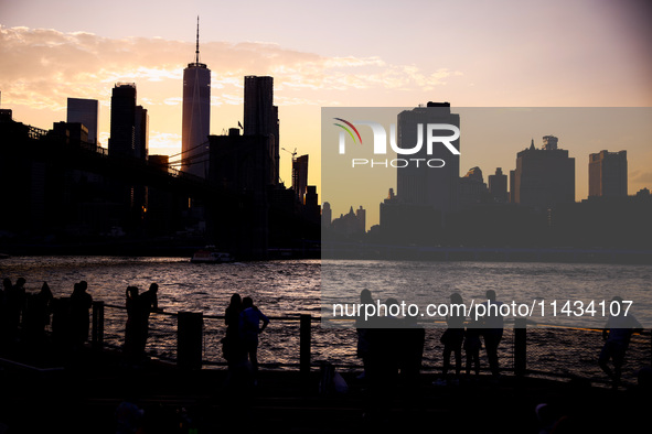  A view on Manhattan sklyline during sunset over the East River in New York City, United States of America on July 7th, 2024.  