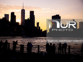  A view on Manhattan sklyline during sunset over the East River in New York City, United States of America on July 7th, 2024.  (