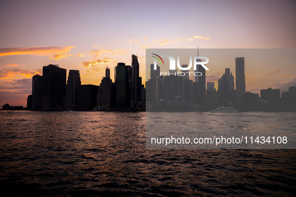  A view on Manhattan sklyline during sunset over the East River in New York City, United States of America on July 7th, 2024.  