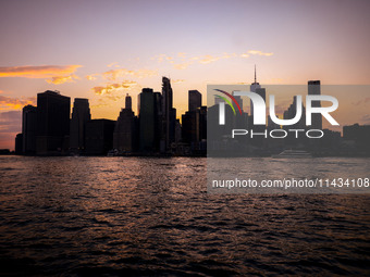  A view on Manhattan sklyline during sunset over the East River in New York City, United States of America on July 7th, 2024.  (