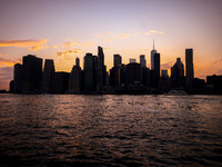  A view on Manhattan sklyline during sunset over the East River in New York City, United States of America on July 7th, 2024.  (