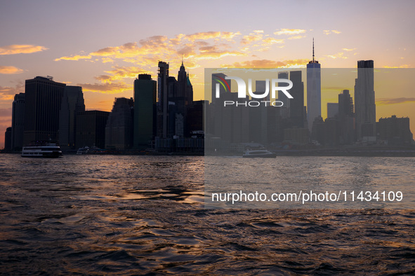  A view on Manhattan sklyline during sunset over the East River in New York City, United States of America on July 7th, 2024.  