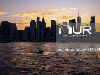  A view on Manhattan sklyline during sunset over the East River in New York City, United States of America on July 7th, 2024.  (