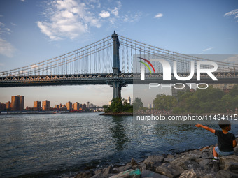  A view on Manhattan Bridge and Pebble Beach in New York City, United States of America on July 7th, 2024.  (