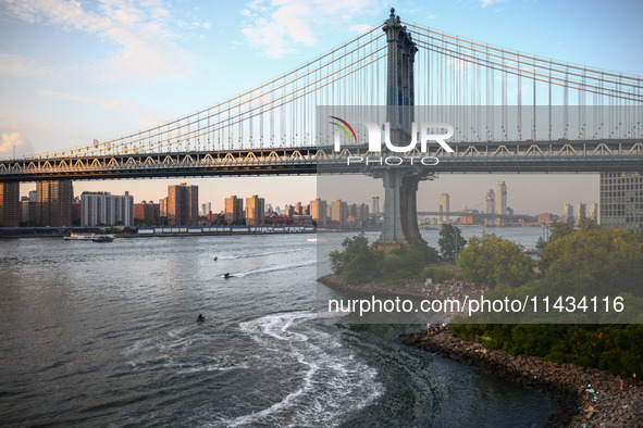  A view on Manhattan Bridge and Pebble Beach in New York City, United States of America on July 7th, 2024.  