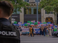 A group is clashing with pro-Israel demonstrators in Republic Square, in City, Country, on Thursday, July 25. The police are trying to keep...