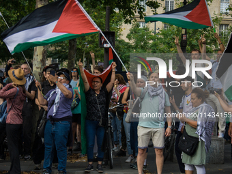 A group is clashing with pro-Israel demonstrators in Republic Square, in City, Country, on Thursday, July 25. The police are trying to keep...