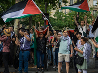 A group is clashing with pro-Israel demonstrators in Republic Square, in City, Country, on Thursday, July 25. The police are trying to keep...