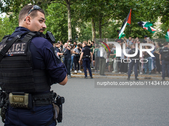 A group is clashing with pro-Israel demonstrators in Republic Square, in City, Country, on Thursday, July 25. The police are trying to keep...