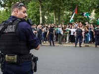 A group is clashing with pro-Israel demonstrators in Republic Square, in City, Country, on Thursday, July 25. The police are trying to keep...