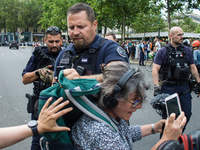 A group is clashing with pro-Israel demonstrators in Republic Square, in City, Country, on Thursday, July 25. The police are trying to keep...