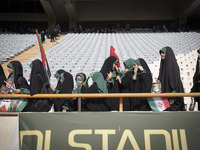 Young veiled schoolgirls are arriving to participate in a gathering to support mandatory hijab at the Azadi (Freedom) Stadium in western Teh...