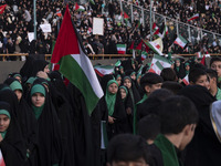 Young veiled schoolgirls and schoolboys are participating in a gathering to support mandatory hijab at the Azadi (Freedom) Stadium in Tehran...