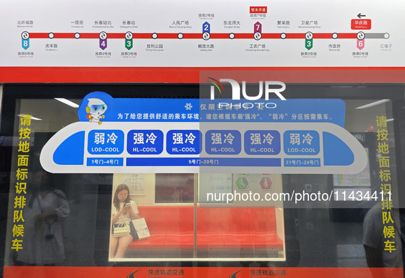 A strong cold and weak cold ''double warm carriage'' sign is being seen at a subway station in Changchun, China, on July 17, 2024. In recent...