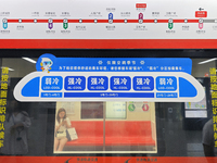 A strong cold and weak cold ''double warm carriage'' sign is being seen at a subway station in Changchun, China, on July 17, 2024. In recent...