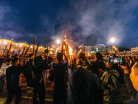 People are celebrating the Torch Festival at Torch Square in Butuo county, Liangshan Yi autonomous prefecture, in Sichuan, China, on July 22...