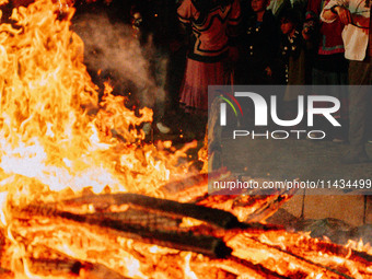 People are celebrating the Torch Festival at Torch Square in Butuo county, Liangshan Yi autonomous prefecture, in Sichuan, China, on July 22...