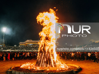 People are celebrating the Torch Festival at Torch Square in Butuo county, Liangshan Yi autonomous prefecture, in Sichuan, China, on July 22...