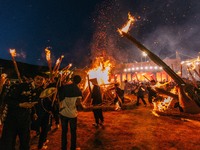 People are celebrating the Torch Festival at Torch Square in Butuo county, Liangshan Yi autonomous prefecture, in Sichuan, China, on July 22...