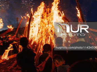 People are celebrating the Torch Festival at Torch Square in Butuo county, Liangshan Yi autonomous prefecture, in Sichuan, China, on July 22...