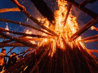 People are celebrating the Torch Festival at Torch Square in Butuo county, Liangshan Yi autonomous prefecture, in Sichuan, China, on July 22...