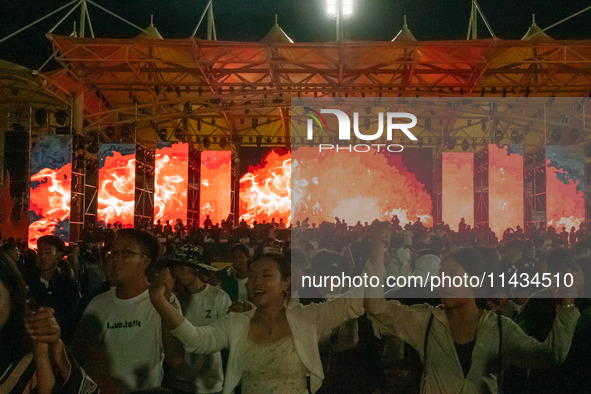 People are celebrating the Torch Festival at Torch Square in Butuo county, Liangshan Yi autonomous prefecture, in Sichuan, China, on July 22...