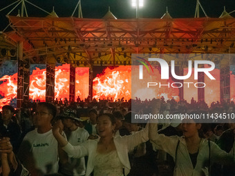 People are celebrating the Torch Festival at Torch Square in Butuo county, Liangshan Yi autonomous prefecture, in Sichuan, China, on July 22...