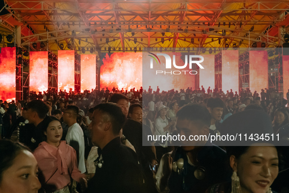 People are celebrating the Torch Festival at Torch Square in Butuo county, Liangshan Yi autonomous prefecture, in Sichuan, China, on July 22...