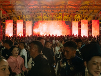 People are celebrating the Torch Festival at Torch Square in Butuo county, Liangshan Yi autonomous prefecture, in Sichuan, China, on July 22...