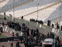 Veiled Iranian women are arriving to participate in a family rally to support mandatory hijab at the Azadi (Freedom) Stadium in western Tehr...