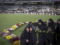 A group of veiled clergywomen are walking together after performing in a family rally to support mandatory hijab, at the Azadi (Freedom) Sta...